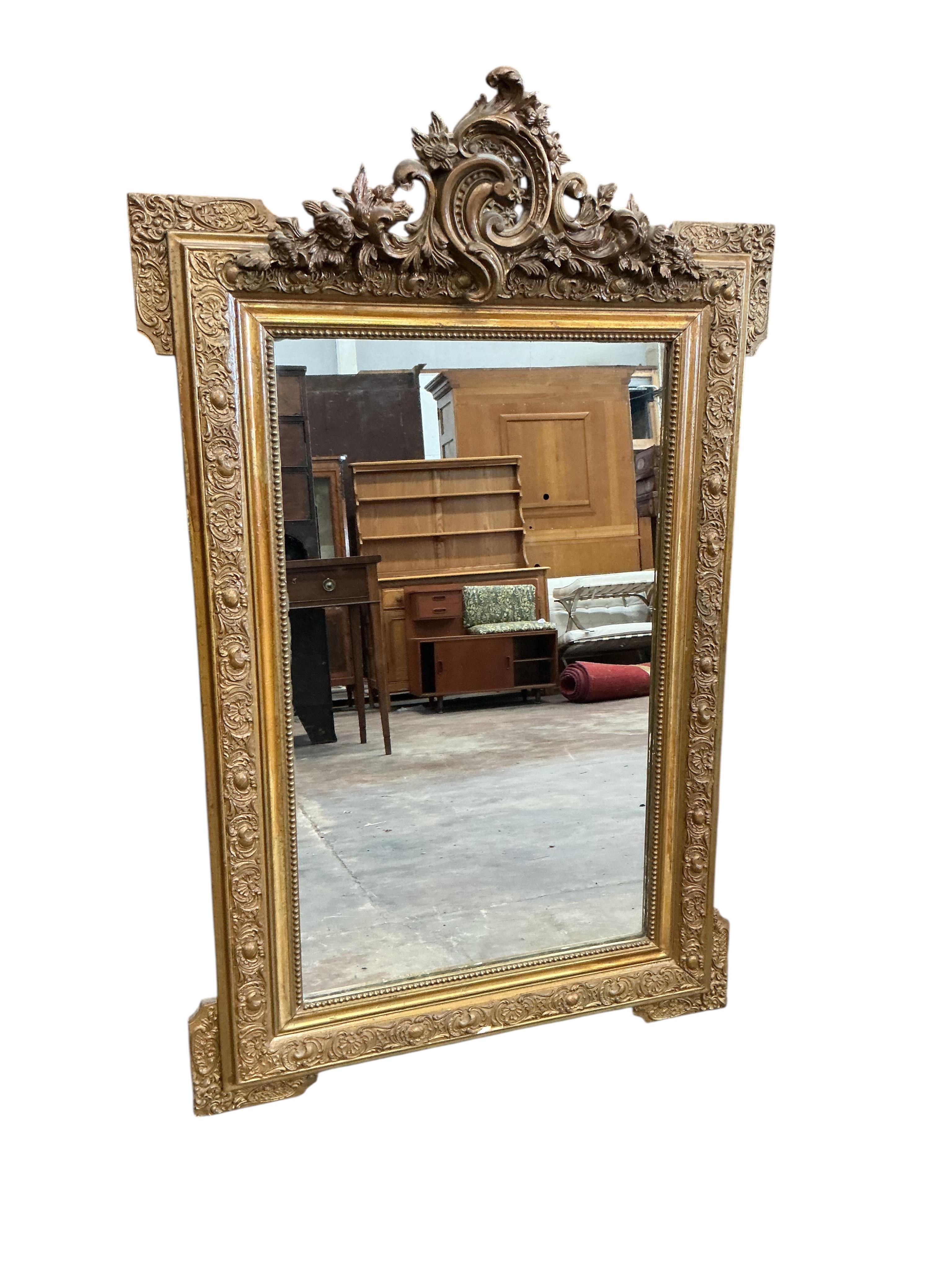 A late 19th century French giltwood and composition wall mirror, later painted, width 78cm, height 124cm